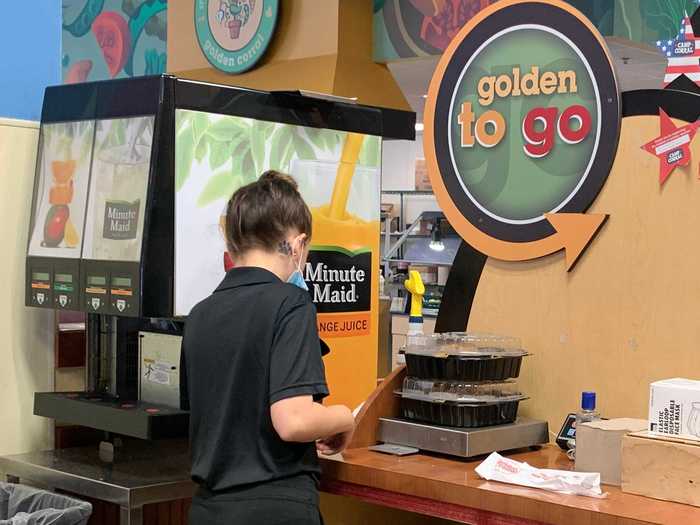 To checkout and pay, the cashier weighed the containers. It worked similarly to a hot bar at a place like Wegmans.