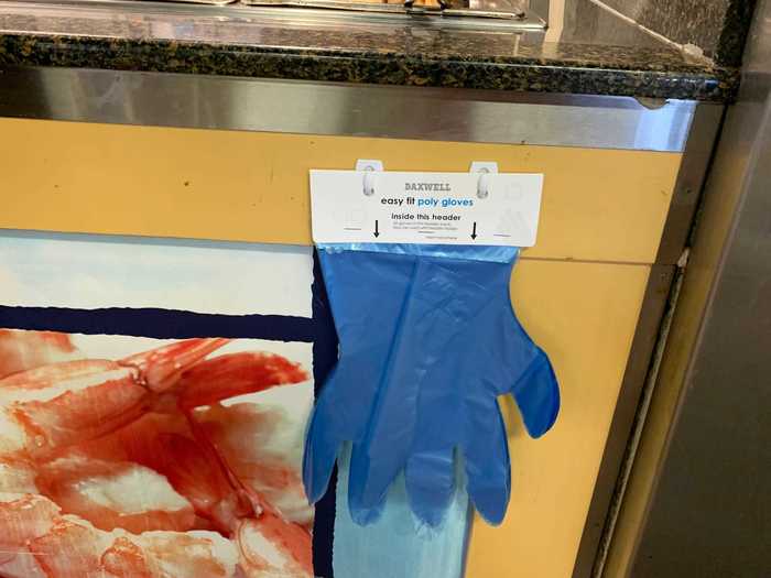 There were disposable gloves available for customers who wanted to wear them when touching the communal serving utensils, but I didn