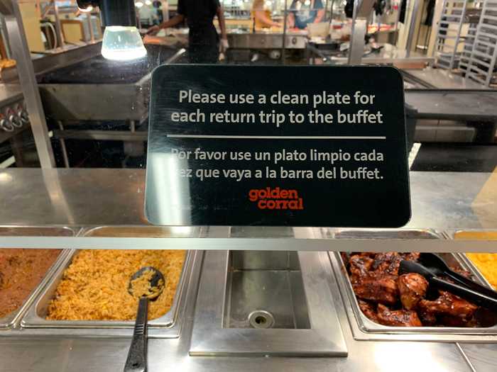 Signs throughout the food stations asked customers to use a clean plate on each buffet trip.