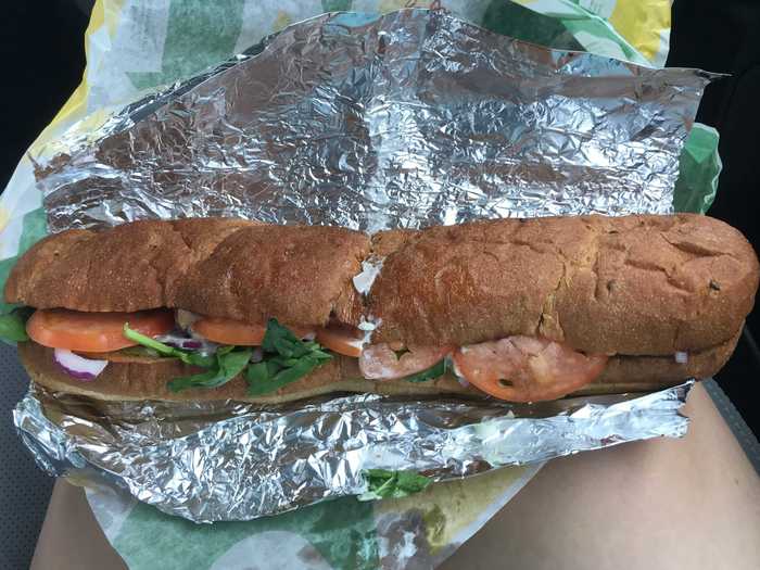 It came with spinach, tomatoes, red onions, mayonnaise, and steak on multigrain bread.