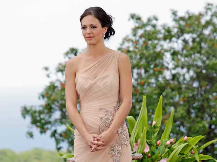 Desiree Hartsock was the first Bachelorette to wear a one-shoulder gown, and the first to wear her hair up since Meredith Phillips. She wore this nude gown with detailed beading at her proposal in Antigua in 2013.
