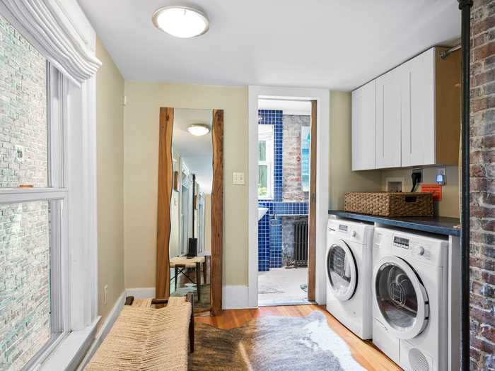 Upstairs, the second floor includes the bathroom, laundry room, and a sitting area, the Zillow listing says.