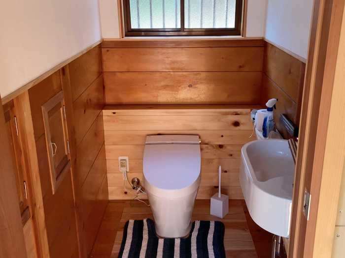 In the separate toilet room, they upgraded the toilet and added a small sink.