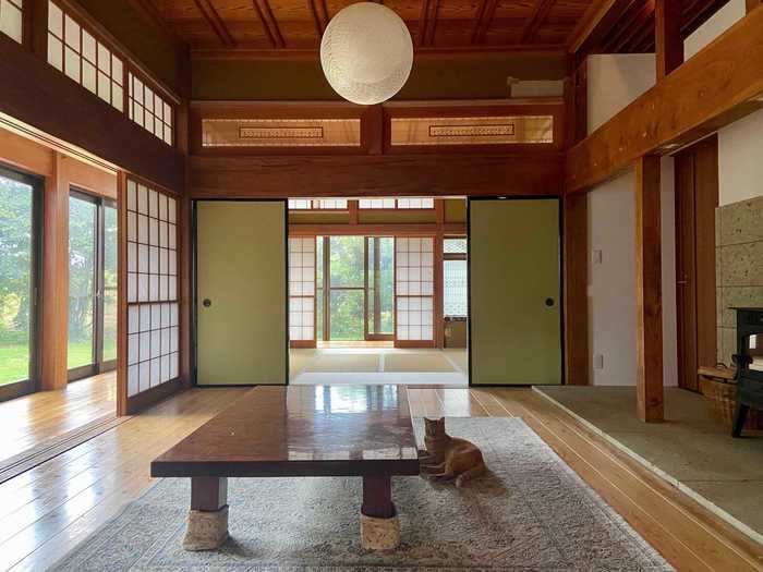 In the living room, they replaced the traditional Japanese sliding doors - called fusuma - and swapped out the traditional tatami flooring for wood flooring. They also installed a wood-burning stove.