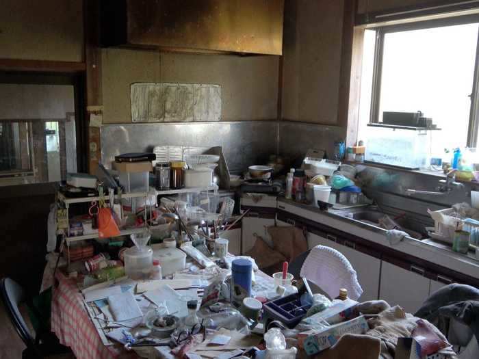 Inside was a similar story. The kitchen was in need of a total overhaul - but first, it needed to be cleared out.