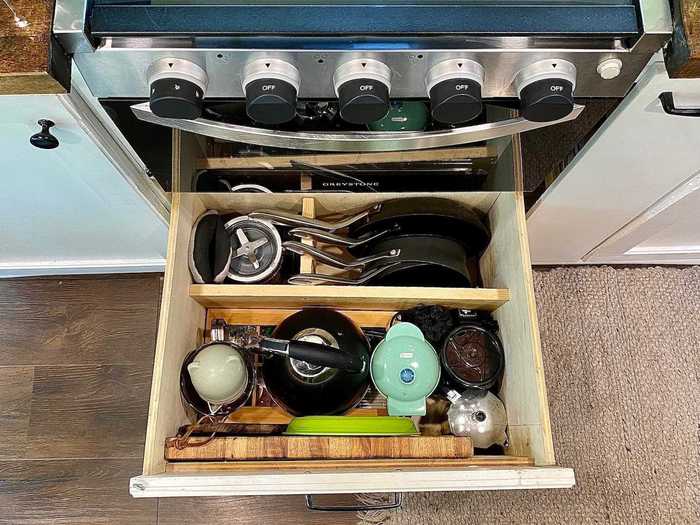 No space is left unused - including an area below the oven where the couple added an extra drawer.