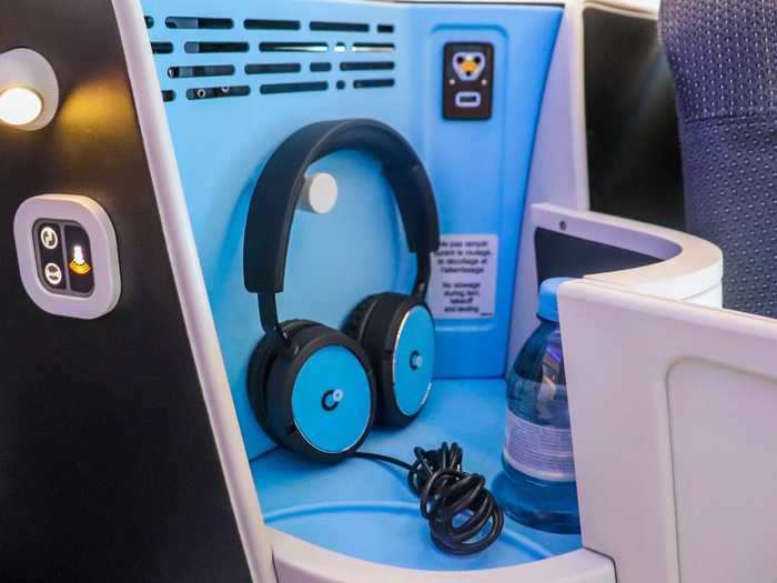 In terms of seat amenities, a pair of noise-canceling headphones can be found at each seat.