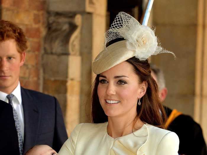 When Prince George was born, Kate Middleton wore a cream ruffled dress by Alexander McQueen that matched the royal family