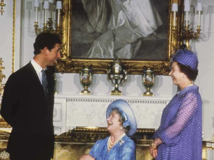 The Queen Mother and Queen Elizabeth wore dresses in shades of blue and purple.