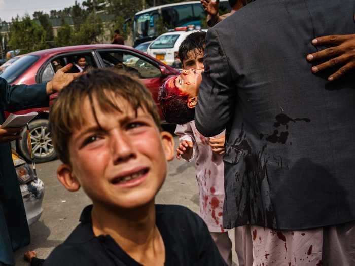 At least six people, including a woman and her child, were wounded outside the airport within the hour of violent escalation, according to the photographer.