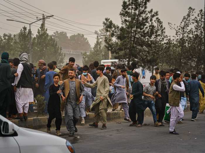 Yam took photos of Afghans looking to flee the nation after Taliban forces regained control of the country over the weekend.