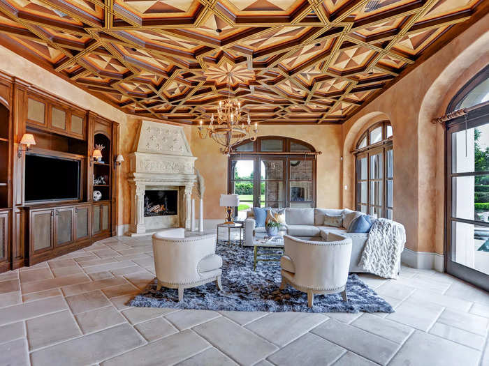 And the family room features super cool custom wood detailing on the ceiling as well.