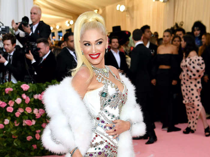 She attended the 2019 Met Gala in a rhinestone bustier, fishnets, and a dramatic feather and Swarovski crystal cape designed by Jeremy Scott for Moschino.