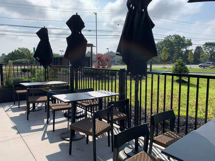 There was seating outside on the patio, but no one was using it and umbrellas were still closed.