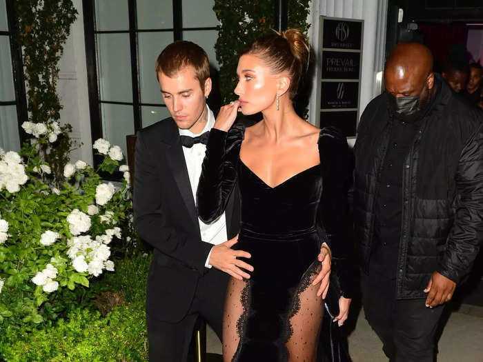 Bieber wore an edgier Alessandra Rich velvet gown that had thigh-high slits with sheer panels on each side for a night out with her husband.