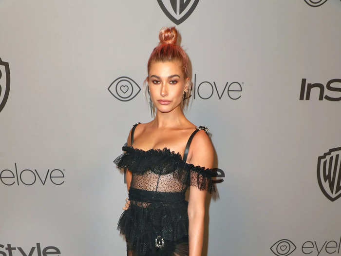 Bieber walked the red carpet at the 2018 InStyle and Warner Bros Golden Globes after-party in a DSquared2 dress with sheer paneling and ruffles all over.