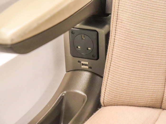 Seats in this cabin came with power outlets, storage slots, and personal reading lights. They also recline for additional comfort.