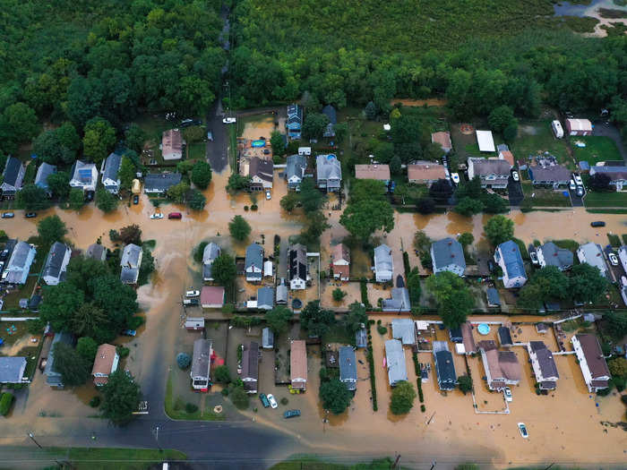 Tropical Storm Henri, downgraded from a Category 1 hurricane, made landfall on Sunday in Rhode Island.