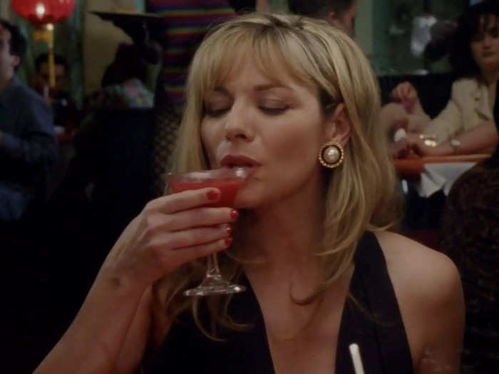 Samantha Jones wears a sexy black halter-neck dress in her first scene of the show.