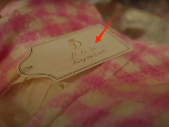 The "POW" on the tags attached to Diana