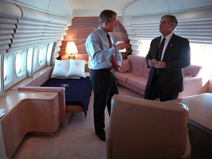 Bush conferred with chief of staff Andy Card in his stateroom, designed by Nancy Reagan.