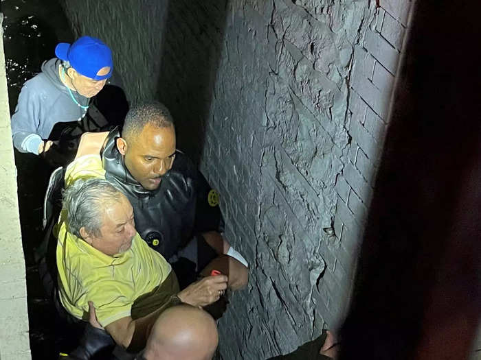 The NYPD rescued some residents from their flooding homes.