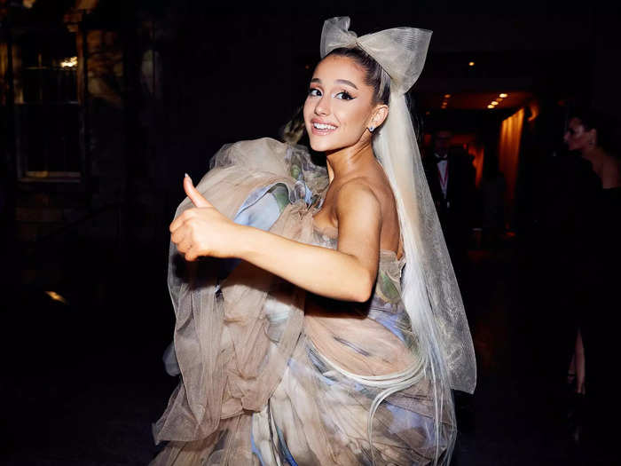 The casual atmosphere extended inside, where Ariana Grande was photographed giving a thumbs up while holding her skirt.