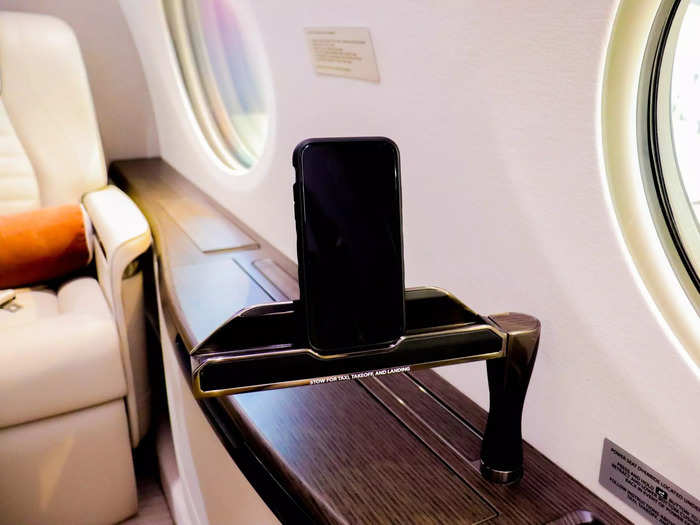 This aircraft had device holders installed at every seat that pop-up from the sidewall. Other options include having personal in-flight entertainment monitors at each seat.