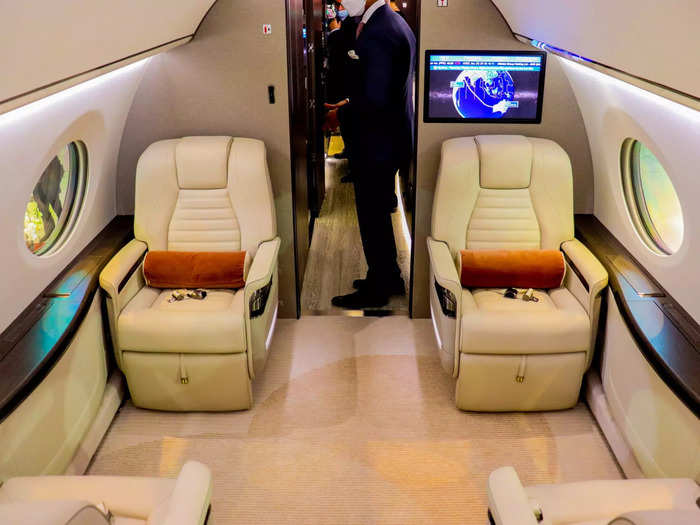 Two pairs of club seats comprise the first of four living spaces on this aircraft.