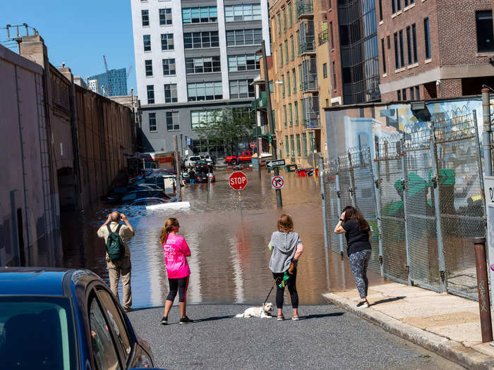 Some residents tried to access their flooded vehicles.