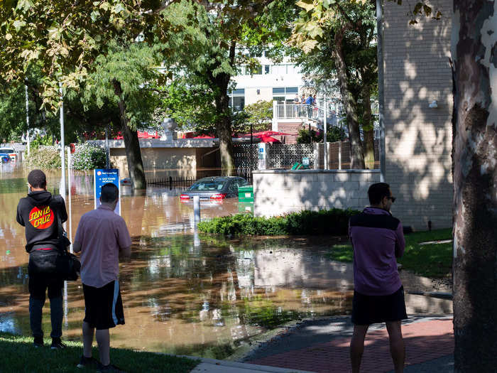 Floodwaters destroyed cars at several apartment buildings.