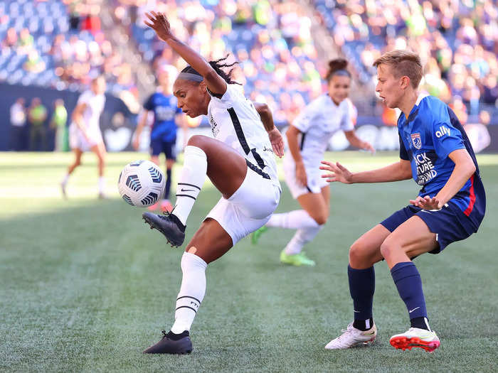 8/29: Portland Thorns star Crystal Dunn traps the ball while guarded by OL Reign