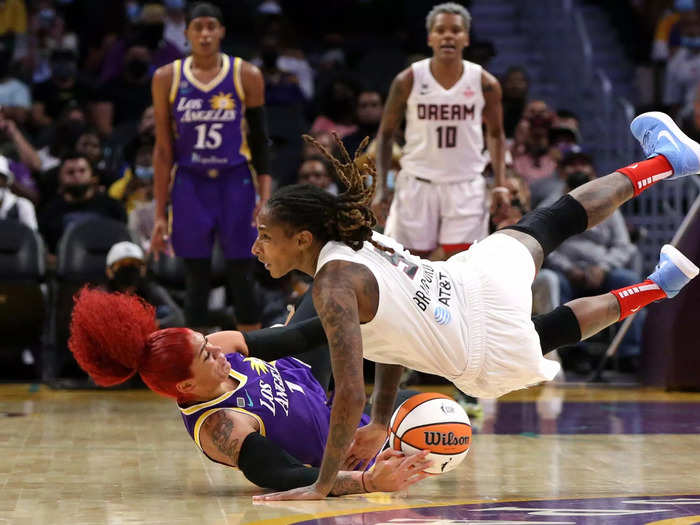 8/17: Amanda Zahui B (left) and Crystal Bradford go after a loose ball during the first half of a WNBA game between the Los Angeles Sparks and Atlanta Dream.