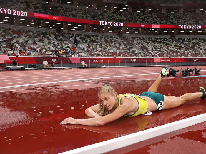 8/4: Genevieve Gregson of Team Australia lays injured during the 3000m steeplechase final at the Tokyo Olympics.