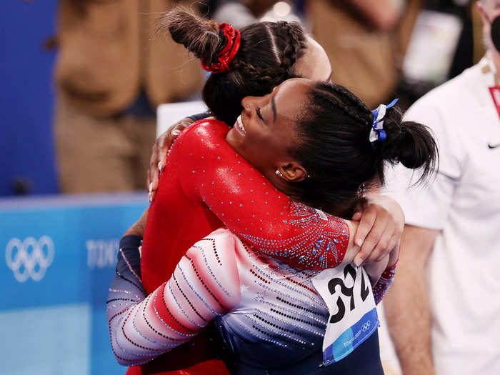 8/3: Simone Biles hugs USA Gymnastics teammate Suni Lee during the balance beam final at the Tokyo Olympics.