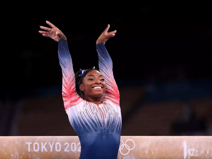 8/3: Simone Biles smiles after completing her balance beam routine at the Tokyo Olympics.