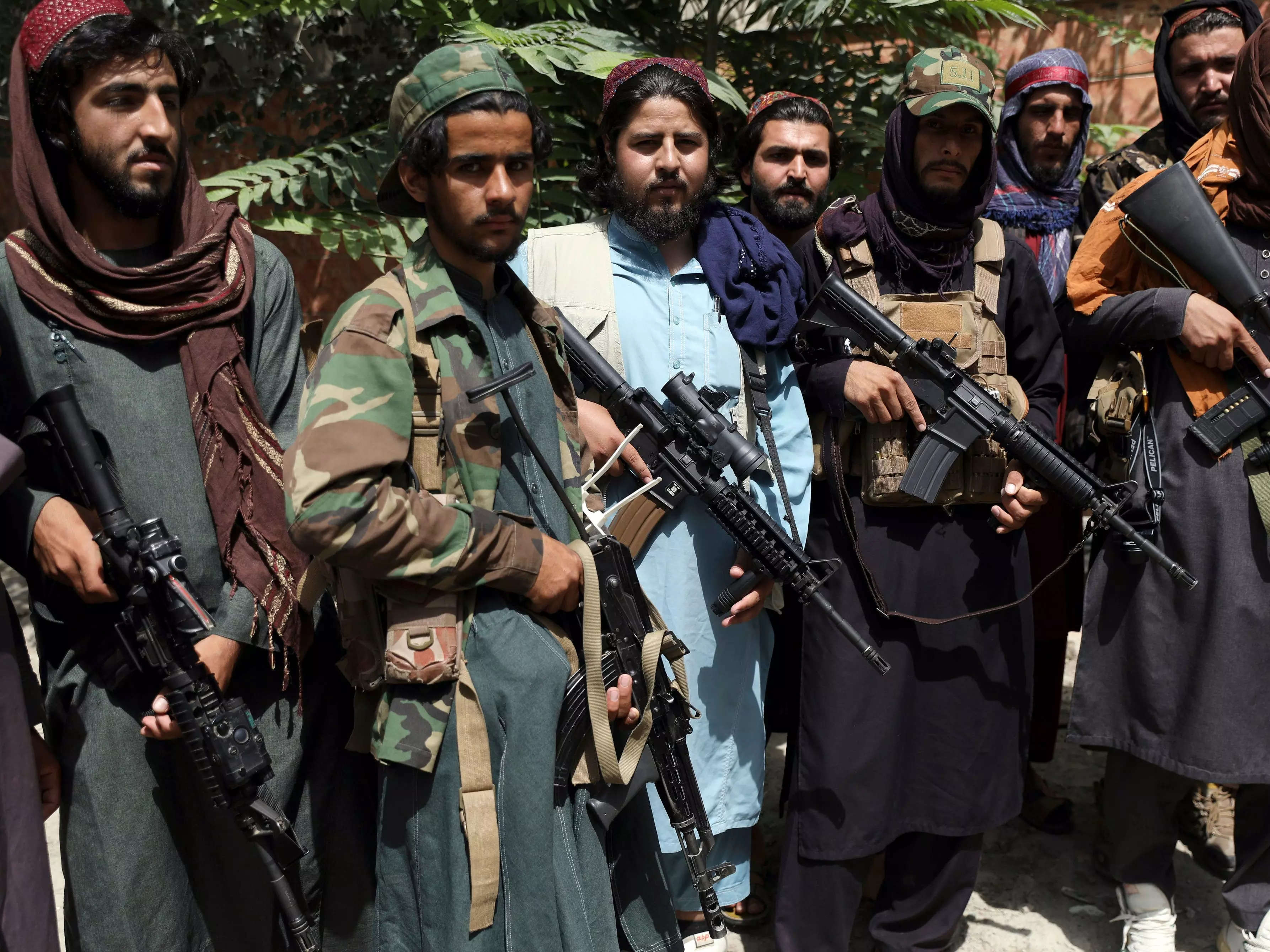 Taliban fighters pose with guns for photograph in Wazir Akbar Khan in the city of Kabul, Afghanistan.