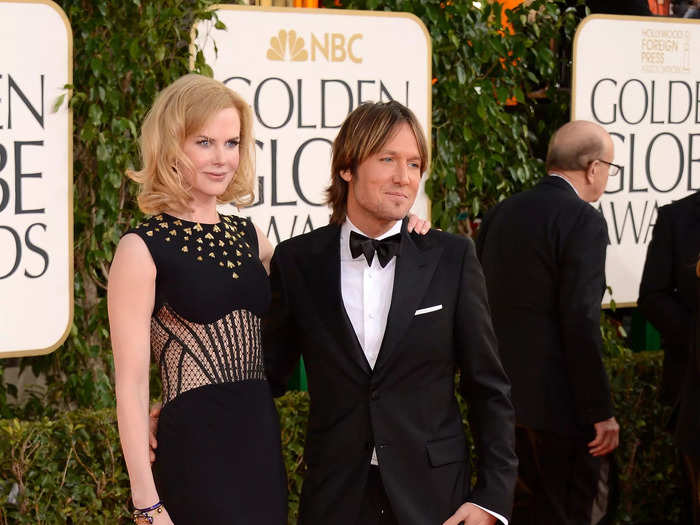 Kidman walked the Golden Globes red carpet with her husband, Keith Urban, in this black dress with a sheer corset bodice and bronze bees in January 2013.