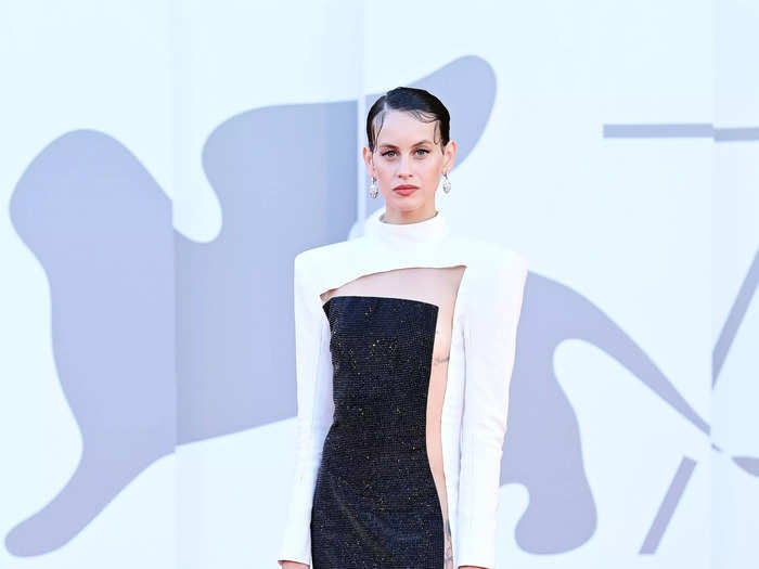 Spanish actress Milena Smit wore a black-and-white dress that had an open slit running down the length of it.