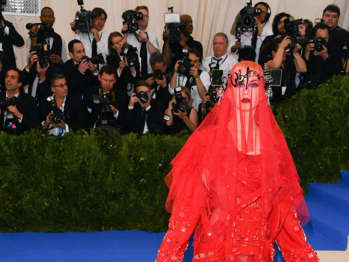 For the "Rei Kawakubo/Comme des Garçons: Art of the In-Between"-themed Met Gala in 2017, Katy Perry wore an eye-catching red tulle gown with a matching veil.