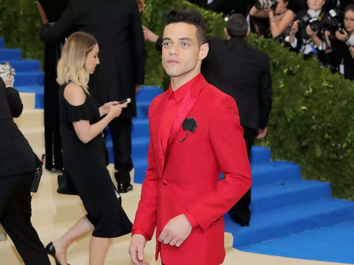 In 2017, Rami Malek wore a bright red suit with a black flower accent.