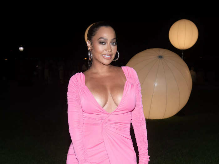 Lala Anthony attended the Prabal Gurung show in a pink dress that had a plunging neckline and thigh-high slit.