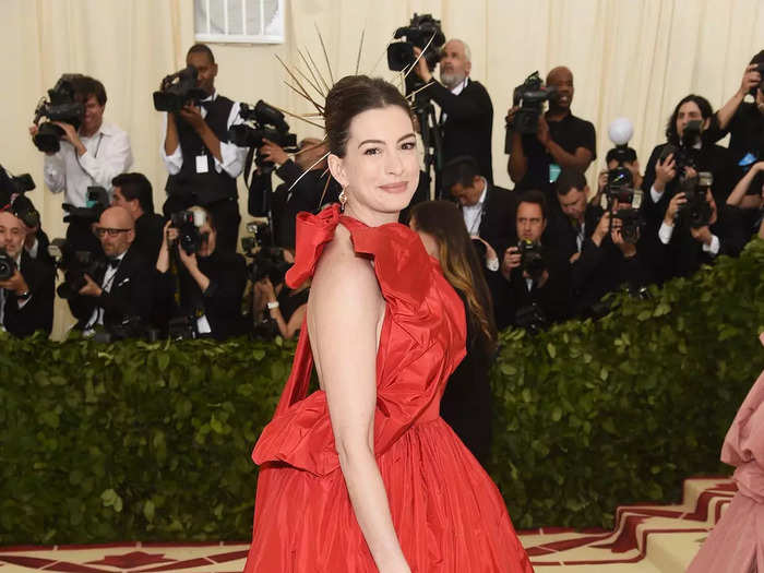 Hathaway opted for a bold red dress with plenty of volume for the Met Gala in 2018.