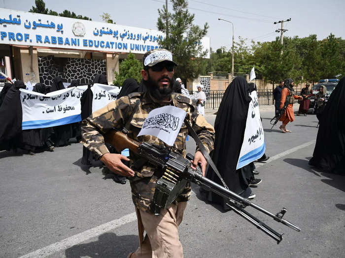 Heavily armed Taliban fighters escorted the women protesters.