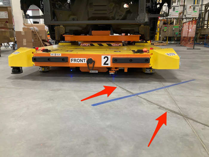 The sleds follow a magnetic track glued into the floor and can sense when a person crosses in front of them.