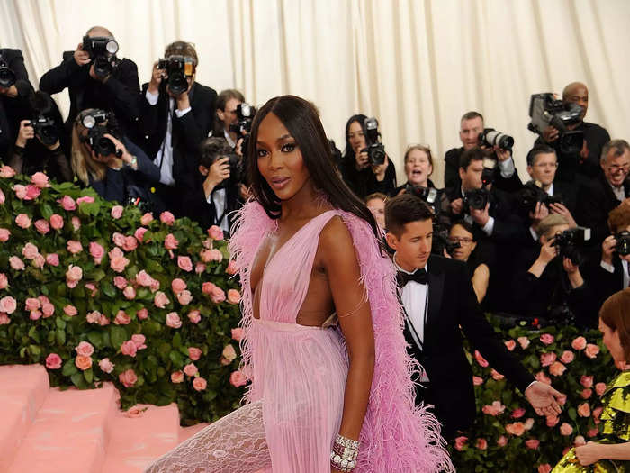 Naomi Campbell looked stunning at the 2019 Met Gala in a lilac Valentino Couture gown and a feather cape.