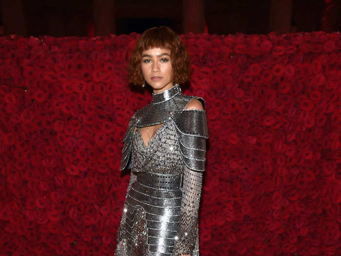 Zendaya embodied Joan of Arc at the 2018 Met Gala in a custom Versace gown that had an armor-like neck-and-shoulder piece, chain mail, a spiked belt, and a train.