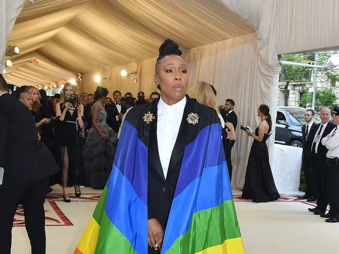 Lena Waithe made a statement at the 2018 Met Gala by wearing a rainbow cape and suit designed by Wes Gordon for Carolina Herrera.