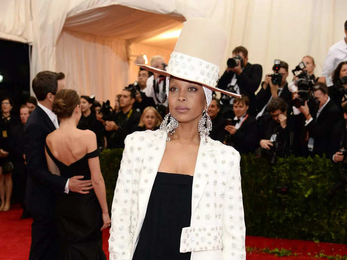 In 2014, Erykah Badu wore a black jumpsuit with a crystal-covered coat, a matching silk headscarf, and a wool hat - all of which were designed by Givenchy.