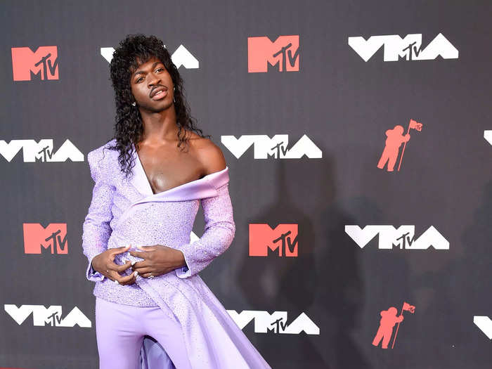 Lil Nas X walked the red carpet in a head-to-toe purple Atelier Versace look.